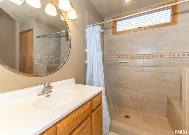 bathroom featuring a shower with curtain and vanity