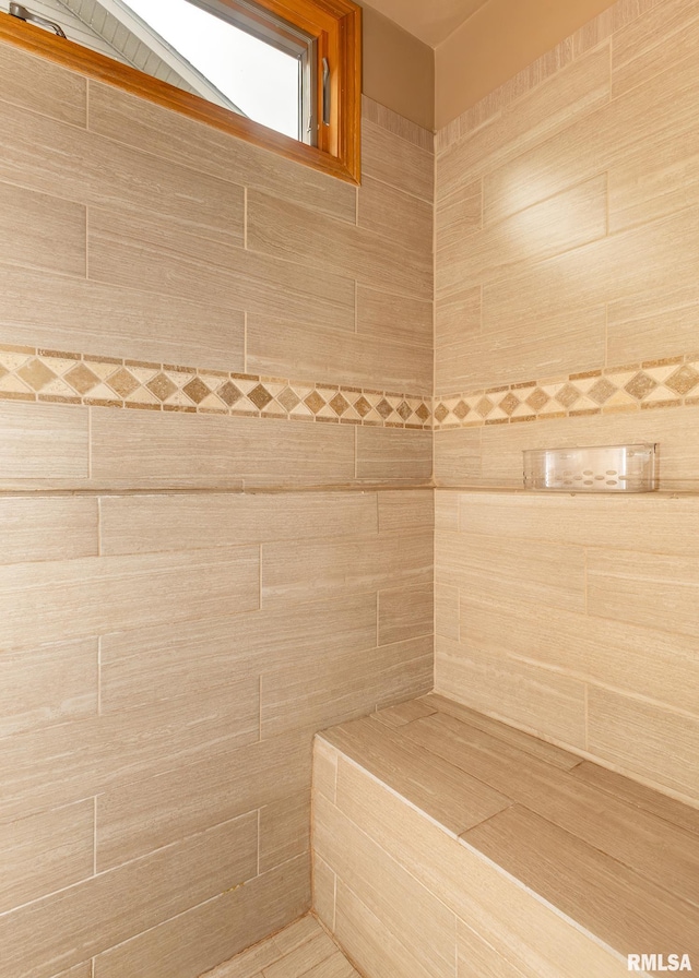 bathroom with tiled shower