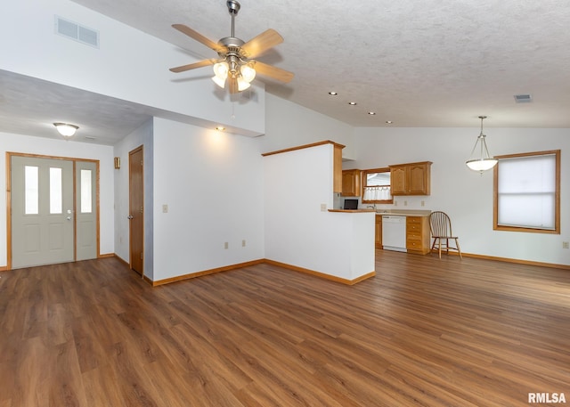 unfurnished living room featuring a textured ceiling, ceiling fan, dark hardwood / wood-style floors, and lofted ceiling