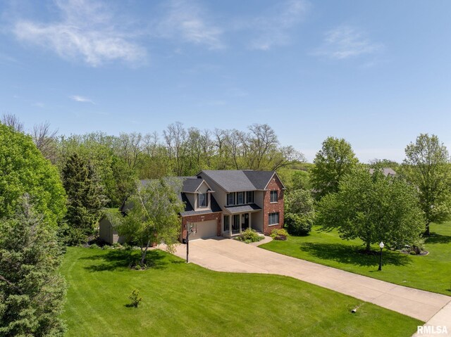 view of front of house with a front lawn and a garage