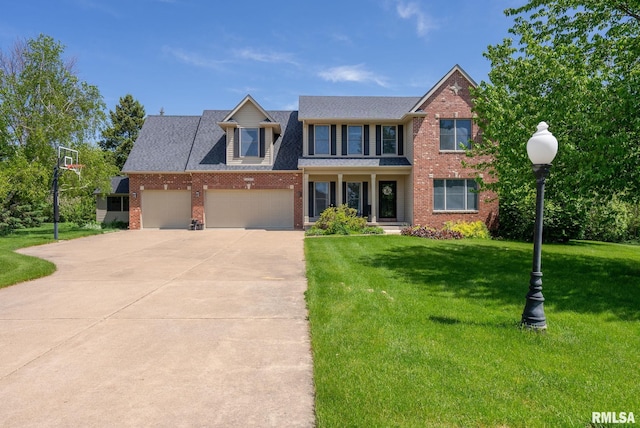 view of front facade featuring a garage and a front lawn