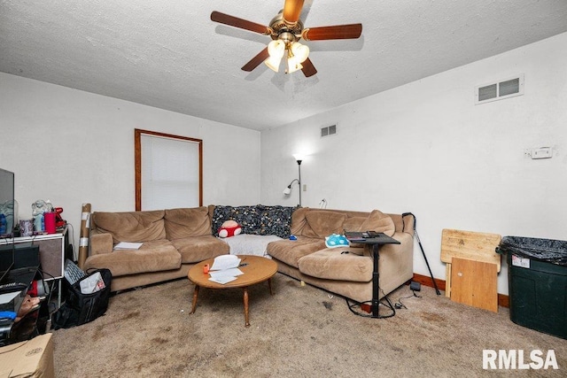 carpeted living room with a textured ceiling and ceiling fan