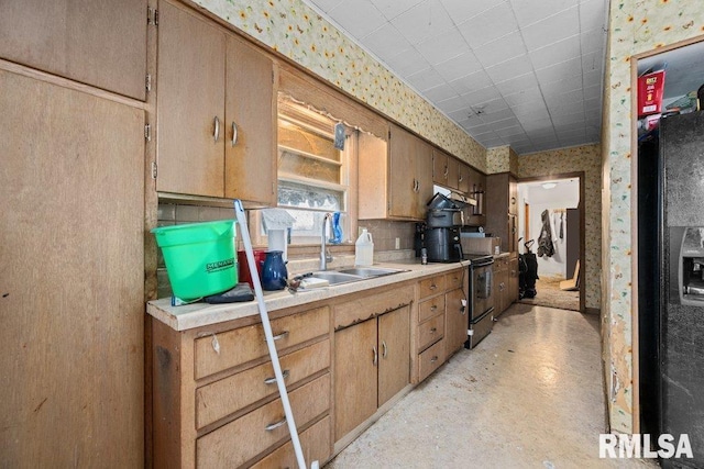 kitchen featuring black appliances and sink