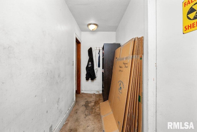 hallway with a textured ceiling