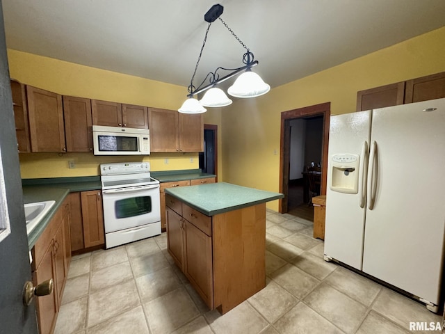 kitchen featuring pendant lighting, white appliances, sink, light tile patterned floors, and a kitchen island