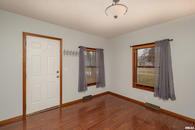 spare room featuring hardwood / wood-style flooring