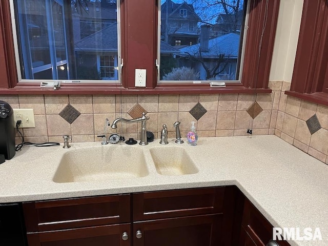 kitchen featuring tasteful backsplash and sink