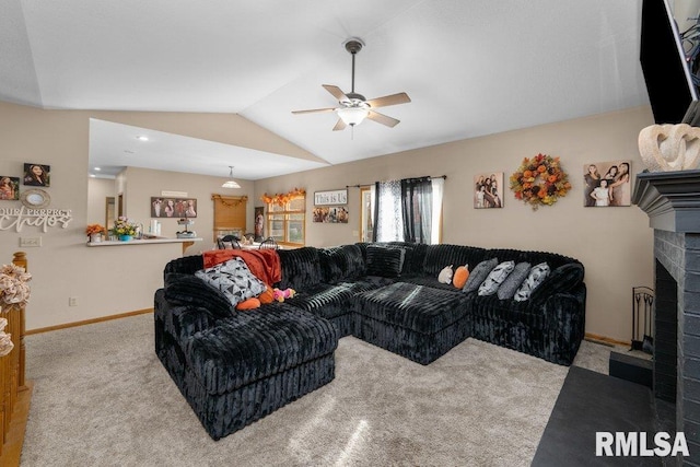 living room featuring carpet flooring, ceiling fan, vaulted ceiling, and a brick fireplace