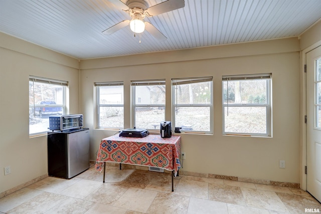 home office featuring a wealth of natural light and ceiling fan