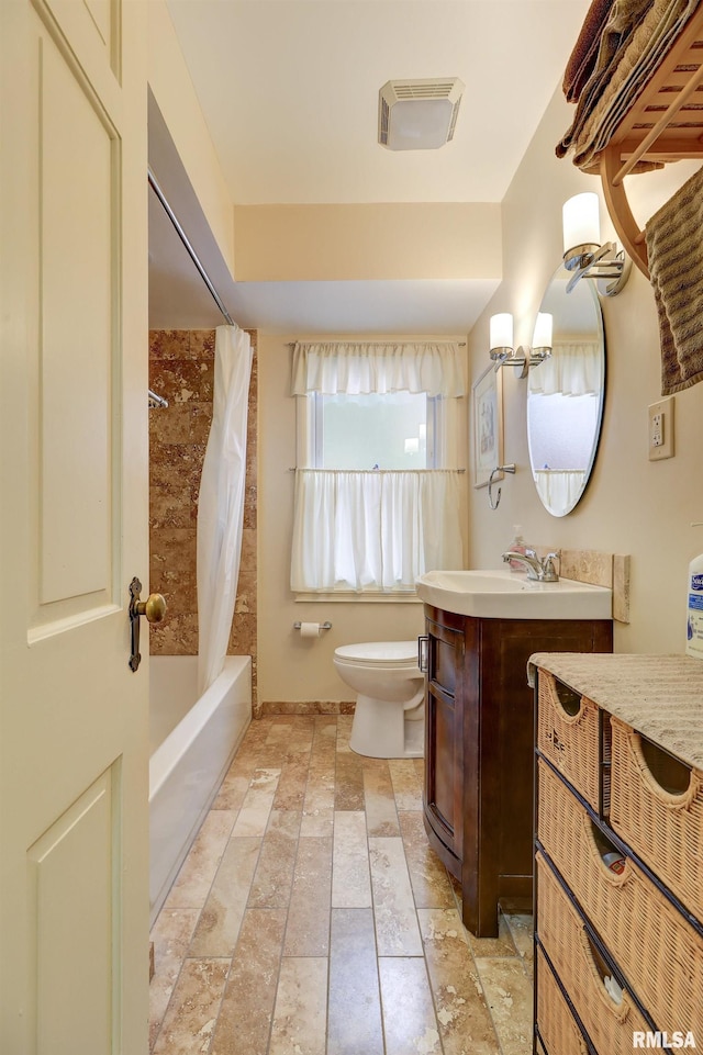 full bathroom with vanity, shower / bath combination with curtain, and toilet