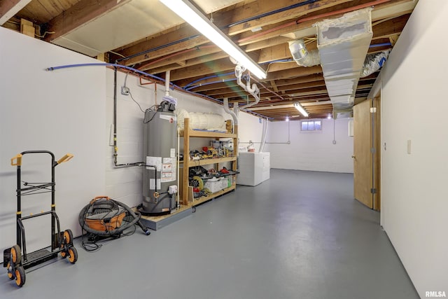 basement with washer and clothes dryer and gas water heater