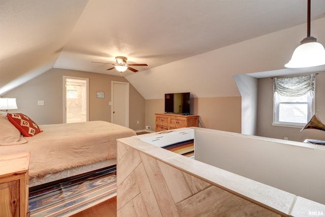 bedroom with wood-type flooring, vaulted ceiling, and ceiling fan