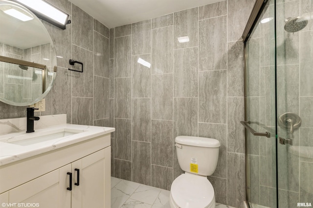 27339 Sherry Ann Ct, Donahue, IA 52746 - full bath with tile walls, marble finish flooring, vanity, and a shower stall