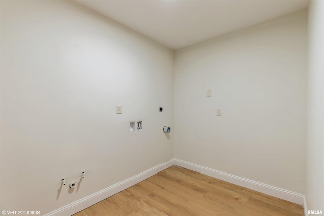27339 Sherry Ann Ct, Donahue, IA 52746 - laundry room featuring gas dryer hookup, electric dryer hookup, light wood-style flooring, and washer hookup