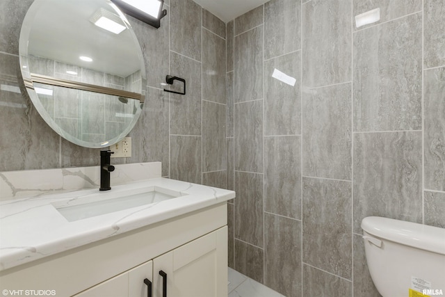 27339 Sherry Ann Ct, Donahue, IA 52746 - full bath featuring tile walls, vanity, and tiled shower