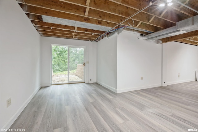 27339 Sherry Ann Ct, Donahue, IA 52746 - below grade area featuring light wood finished floors and baseboards