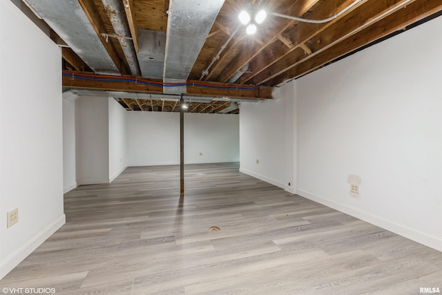 27339 Sherry Ann Ct, Donahue, IA 52746 - finished basement with wood finished floors