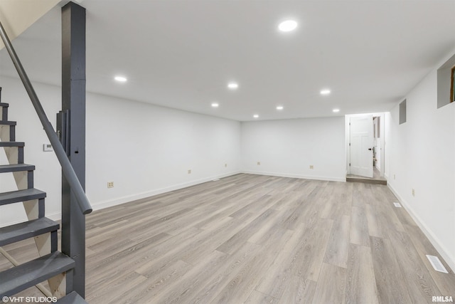 27339 Sherry Ann Ct, Donahue, IA 52746 - finished basement featuring light wood-style flooring, recessed lighting, and stairs