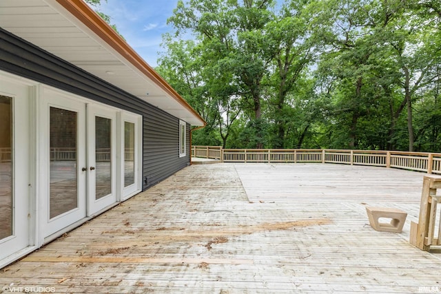 27339 Sherry Ann Ct, Donahue, IA 52746 - wooden deck featuring view of wooded area