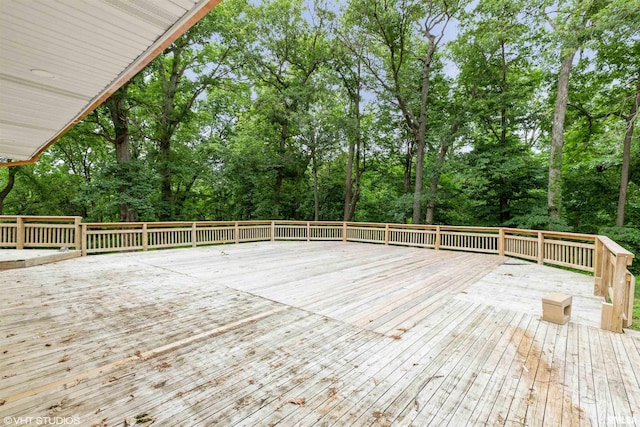 27339 Sherry Ann Ct, Donahue, IA 52746 - wooden deck with view of scattered trees
