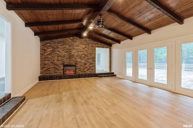 27339 Sherry Ann Ct, Donahue, IA 52746 - unfurnished living room featuring ceiling fan, wood ceiling, wood finished floors, a fireplace, and brick wall