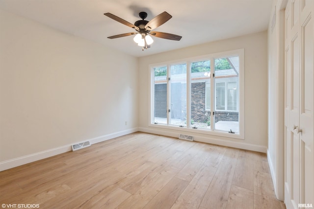 27339 Sherry Ann Ct, Donahue, IA 52746 - unfurnished room with light wood-type flooring and a ceiling fan