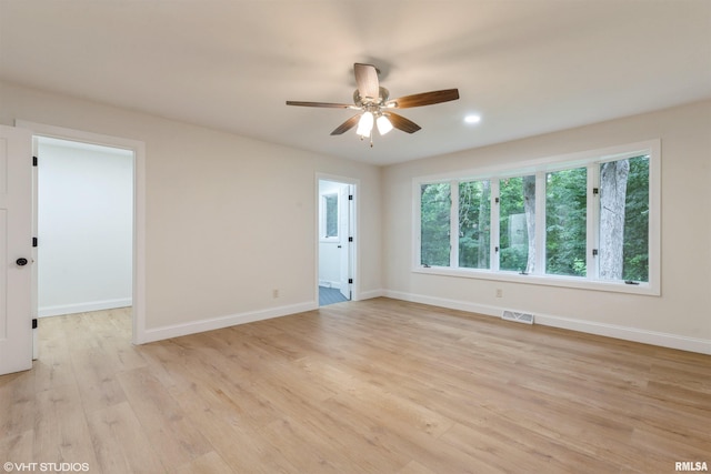 27339 Sherry Ann Ct, Donahue, IA 52746 - unfurnished room featuring light wood finished floors, a ceiling fan, and recessed lighting