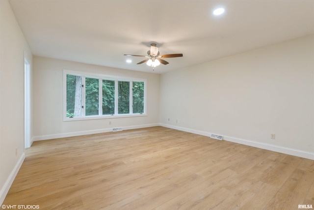 27339 Sherry Ann Ct, Donahue, IA 52746 - empty room featuring ceiling fan, light wood-style floors, and recessed lighting