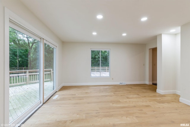 27339 Sherry Ann Ct, Donahue, IA 52746 - unfurnished room featuring light wood-style floors and recessed lighting