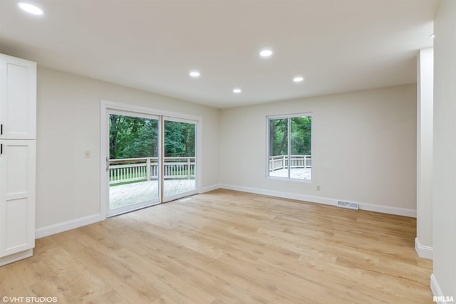 27339 Sherry Ann Ct, Donahue, IA 52746 - spare room with plenty of natural light, light wood-type flooring, and recessed lighting