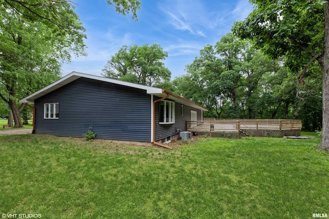 27339 Sherry Ann Ct, Donahue, IA 52746 - view of side of property with a deck and a lawn