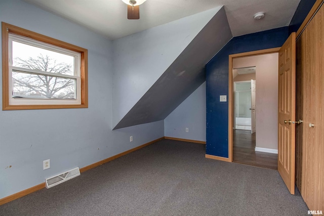 bonus room featuring carpet flooring, ceiling fan, and vaulted ceiling