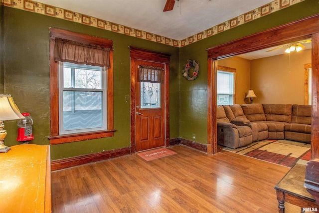 entryway featuring hardwood / wood-style flooring, ceiling fan, and a wealth of natural light