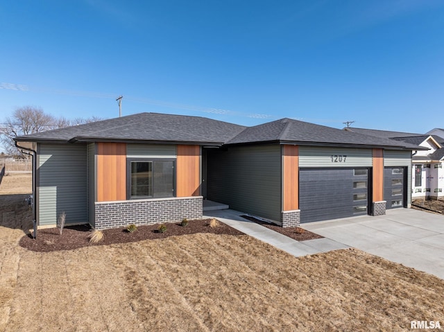 view of front of property with driveway, brick siding, an attached garage, and a shingled roof