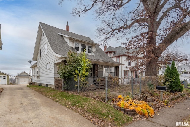 view of front of house featuring an outbuilding and a garage