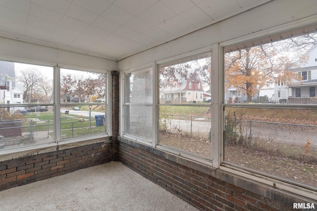 unfurnished sunroom featuring a wealth of natural light