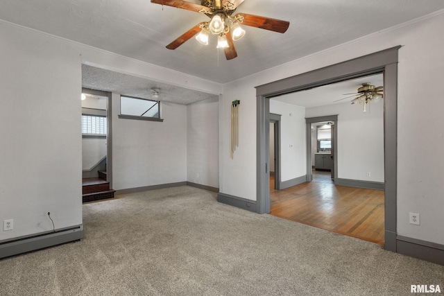 unfurnished room with wood-type flooring, a textured ceiling, plenty of natural light, and ceiling fan