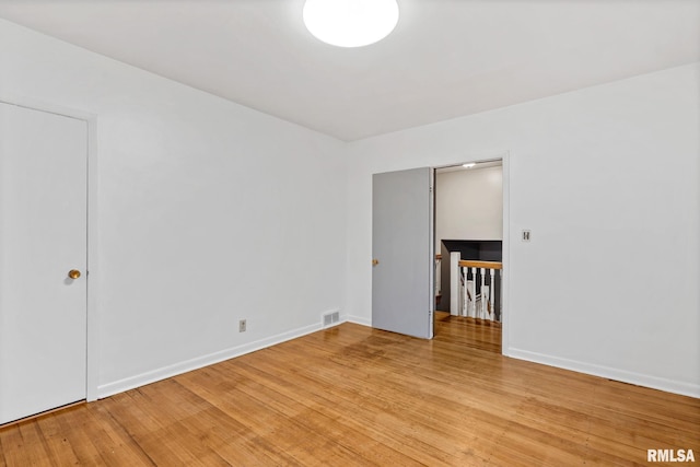 unfurnished room featuring light hardwood / wood-style flooring