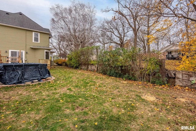 view of yard with a covered pool