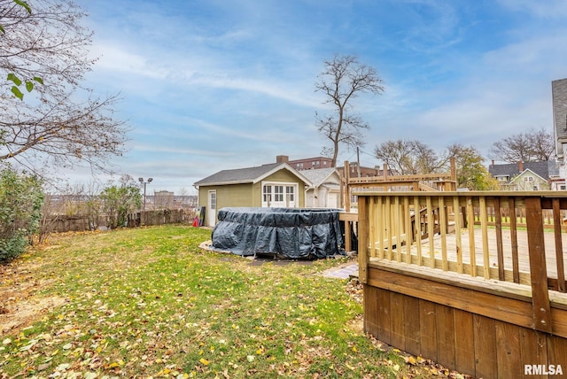 view of yard with a pool side deck