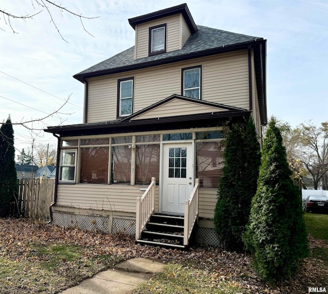 view of front facade with a sunroom