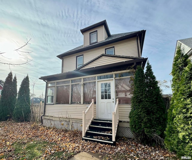 view of front of home with a sunroom