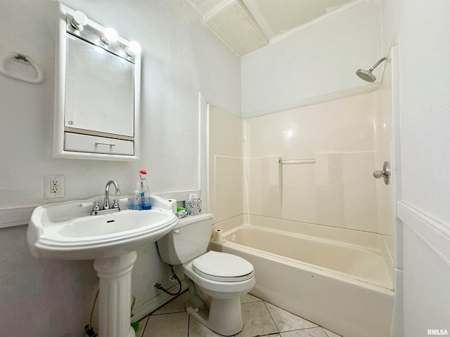 bathroom featuring tile patterned flooring, shower / bathing tub combination, and toilet