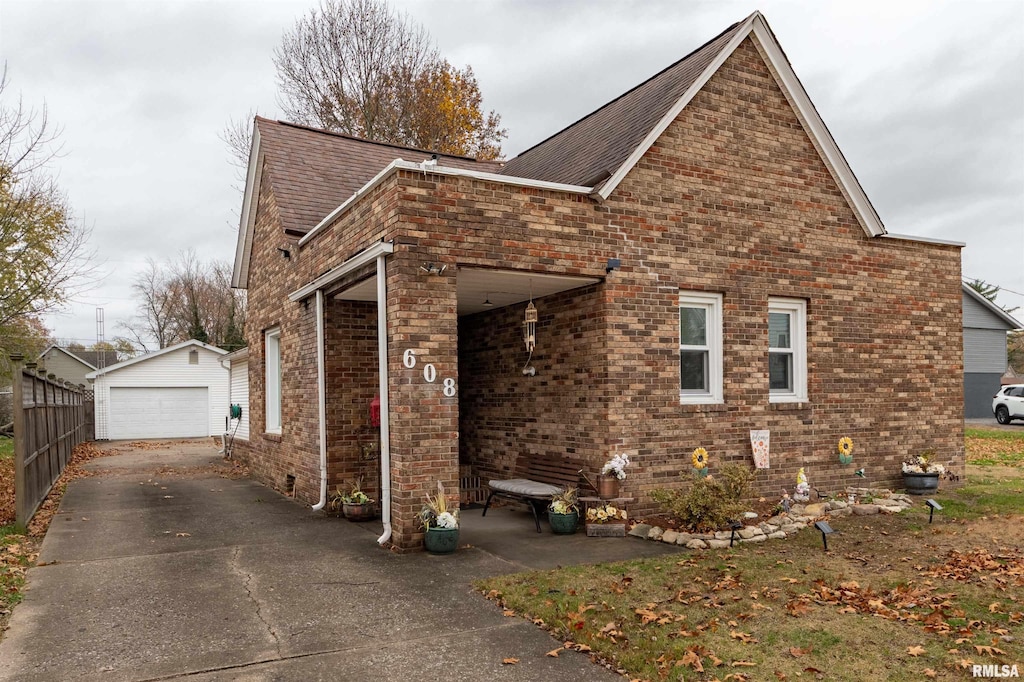 view of front of house featuring an outbuilding and a garage