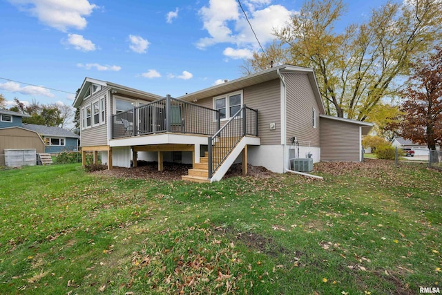 back of house featuring a yard and a deck