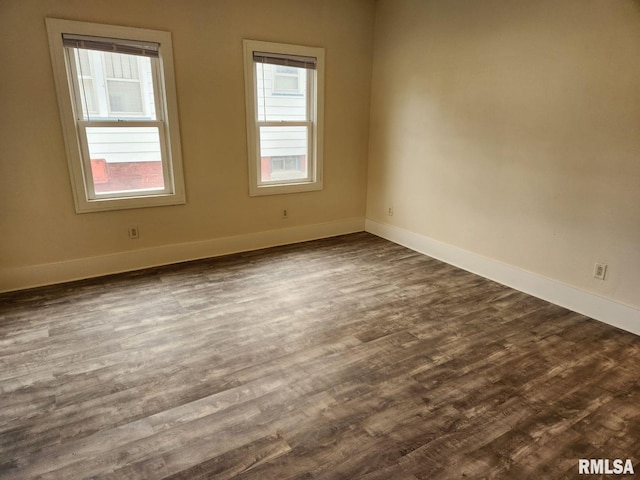 unfurnished room featuring dark hardwood / wood-style floors