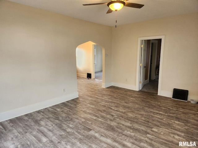 unfurnished room featuring hardwood / wood-style flooring, ceiling fan, and a textured ceiling