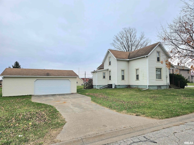 view of side of property featuring a lawn, a garage, an outdoor structure, and central AC