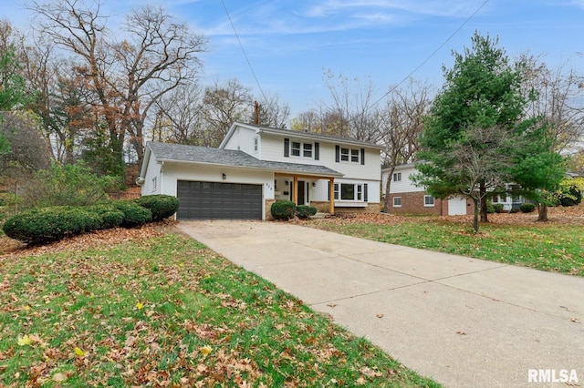 front of property featuring a garage and a front yard