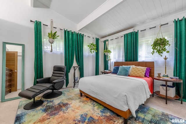 bedroom featuring carpet and lofted ceiling with beams